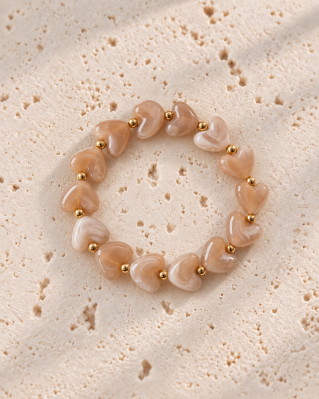 RVS armband beige-lichtbruine hartjes
